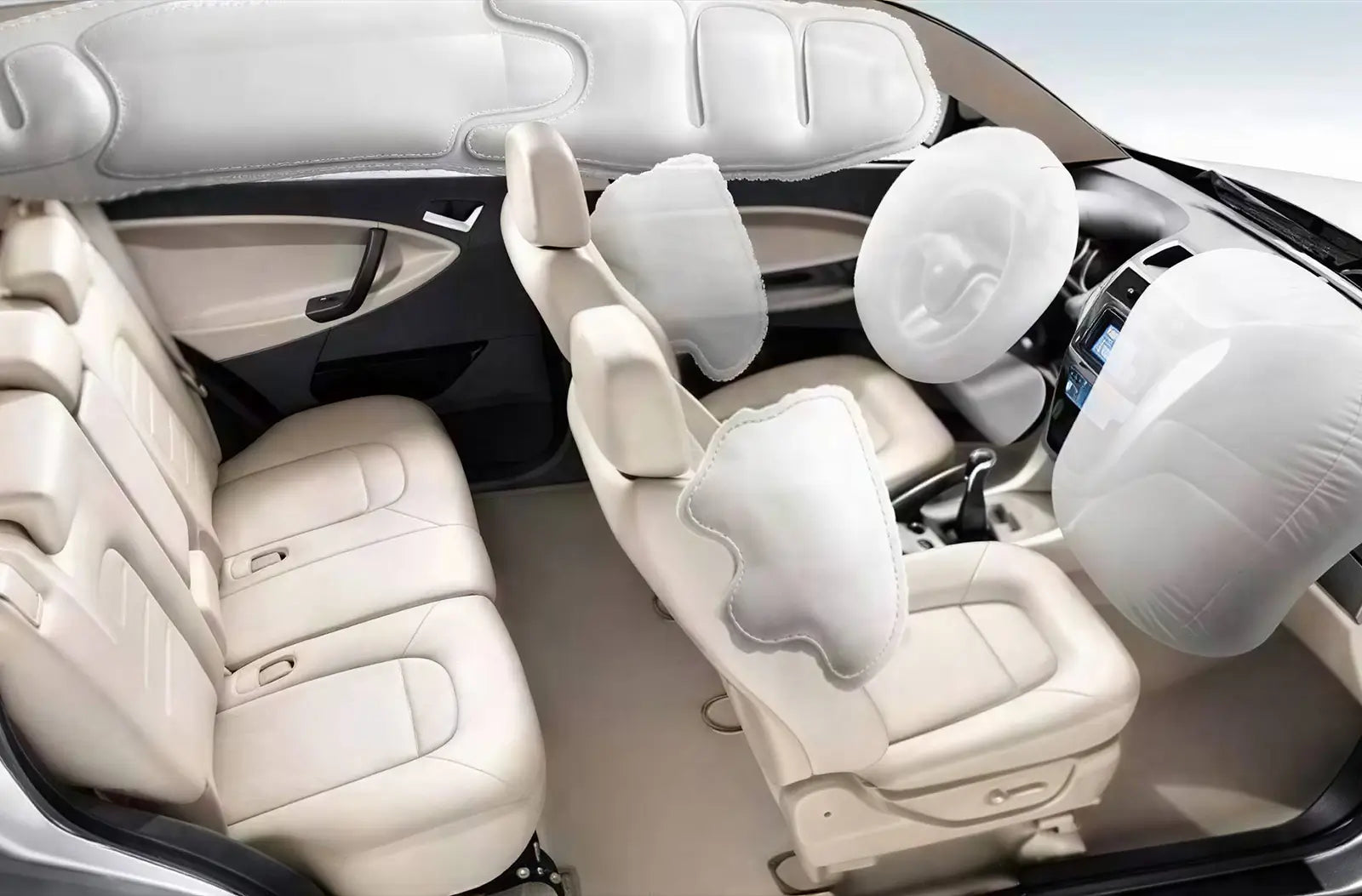 Captures the interior of a vehicle post-collision, showing a fully deployed white driver's side airbag with powdery residue on the steering wheel and dashboard.
