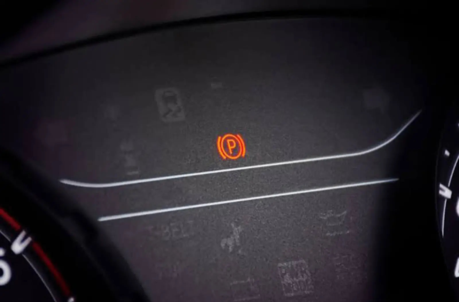 Close-up view of a center console focusing on the electric parking brake (EPB) toggle switch being lifted by a driver's finger.