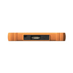 the top edge of a rugged orange diagnostic tool, featuring a USB-C port, a multi-pin serial connector, and a black circular power button. The ports are recessed within the textured casing to provide extra protection during use.