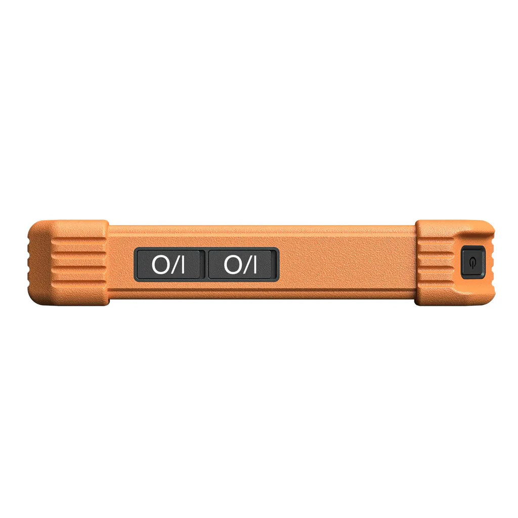 the top edge of a rugged orange device, featuring two large "I/O" buttons and a smaller power button on the right side. The textured casing includes grooved corner bumpers to provide extra impact protection.